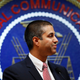 After a meeting voting to end net neutrality, Federal Communications Commission (FCC) Chairman Ajit Pai smiles while listening to a question from a reporter in Washington.